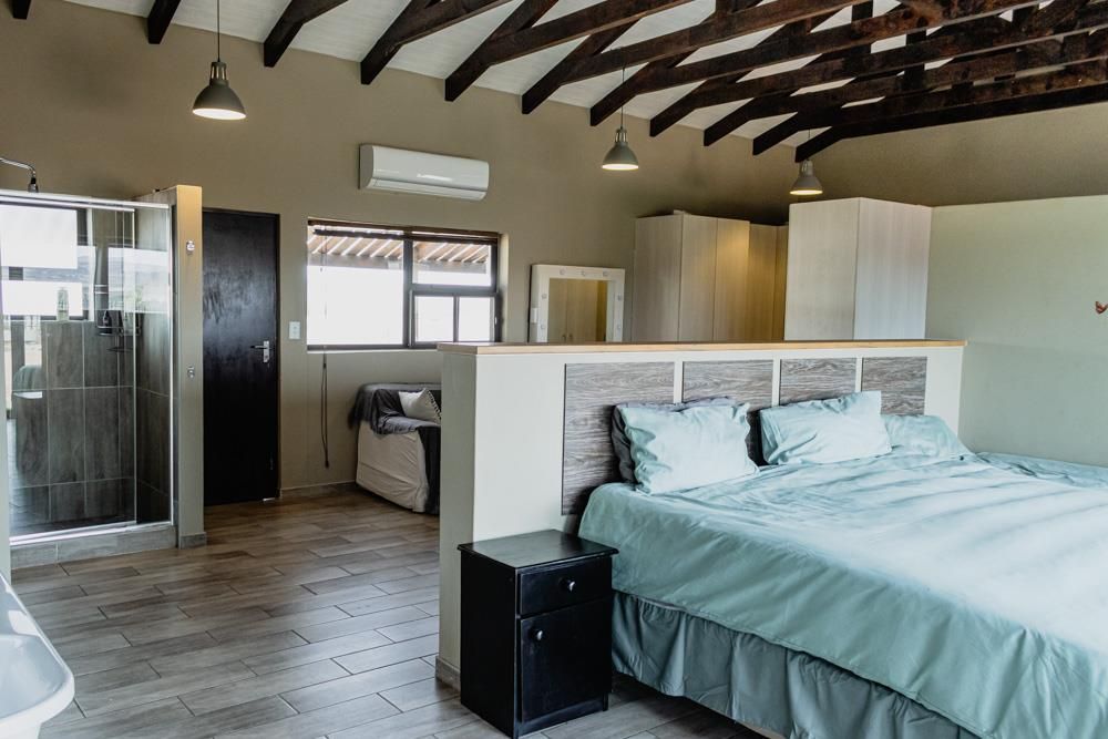 Open-plan bedroom 1 with en-suite bathroom