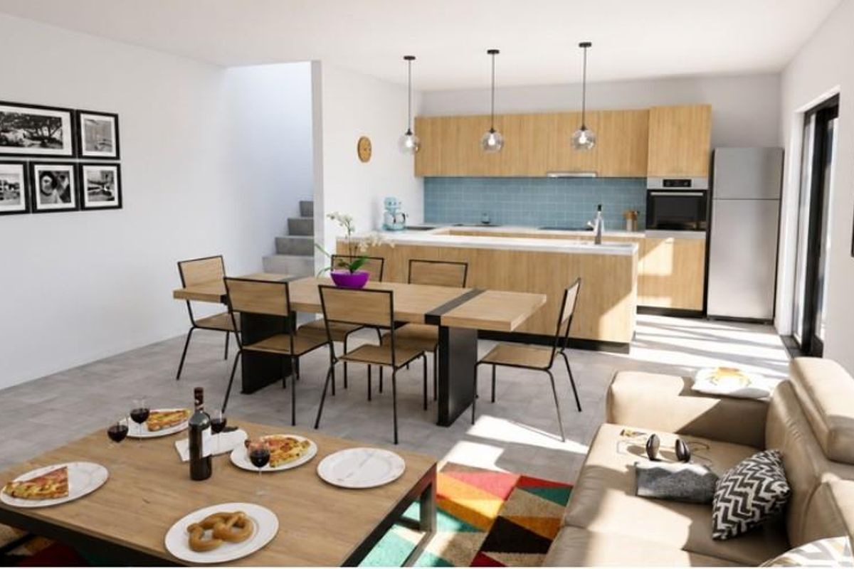 Modern open-plan living and dining area featuring a contemporary kitchen with light wood cabinetry, a central island, and integrated appliances.
