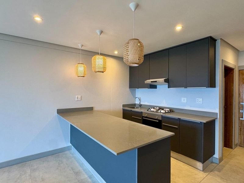 This brand-new, never-before-lived-in apartment offers a refined coastal lifestyle with breathtaking panoramic sea views and sleek, modern finishes throughout - Photo 7