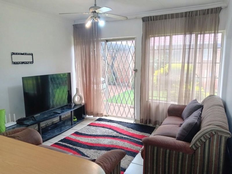 Exceptionally Secure Two-Bedroom Townhouse with Private Garden Retreat - Photo 8
