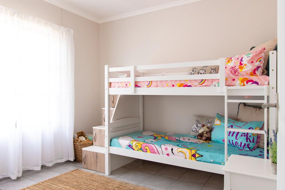 Second bedroom with built-in cupboards.