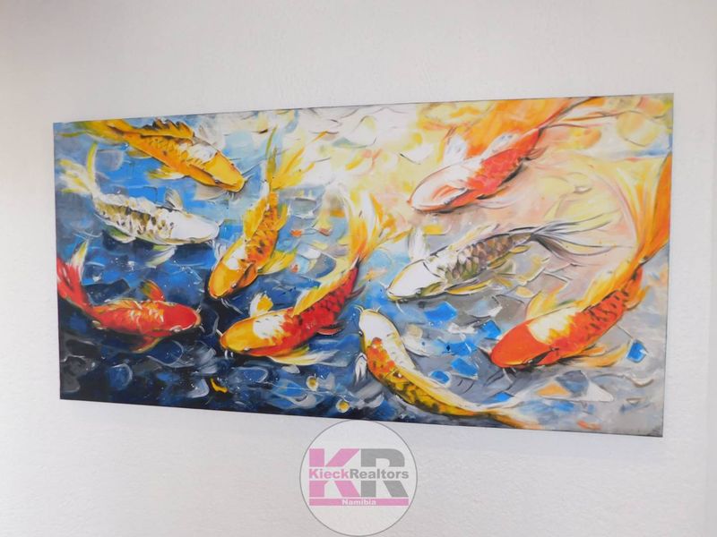 A decorative painting displayed on a wall.