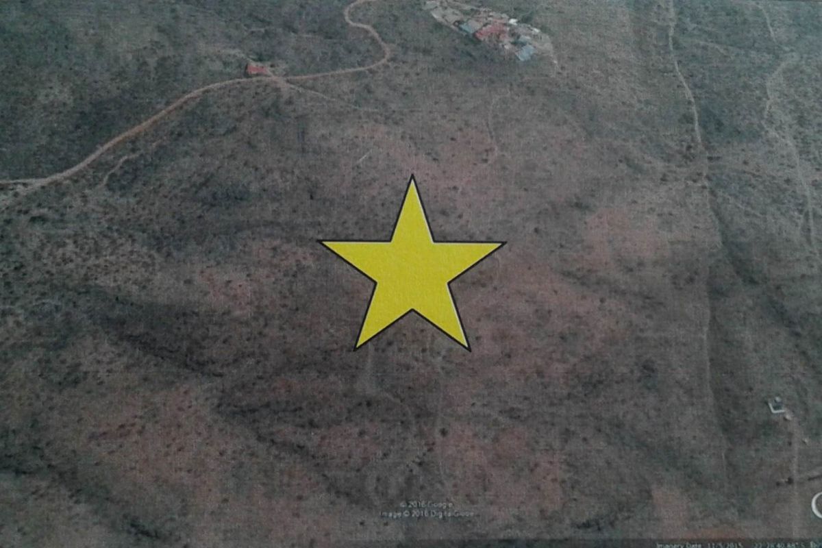 Aerial view of the small holding property, showing the expansive landscape and surrounding terrain.