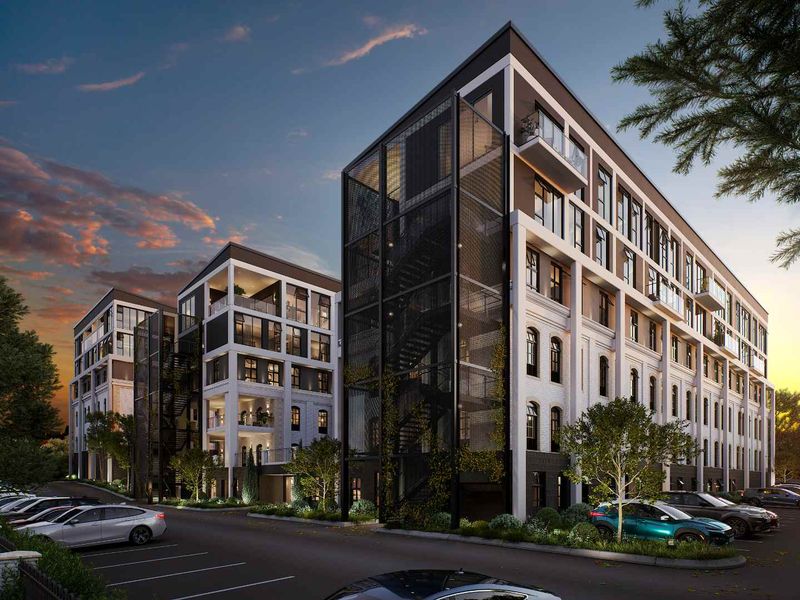 Modern multi-story apartment complex featuring contemporary architectural design, external stairwells, private balconies, and dedicated parking facilities.