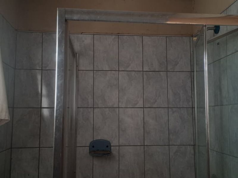 Peaceful 3-Bedroom Family Home with 2 Rondavels for Extra Income Potential - Photo 7