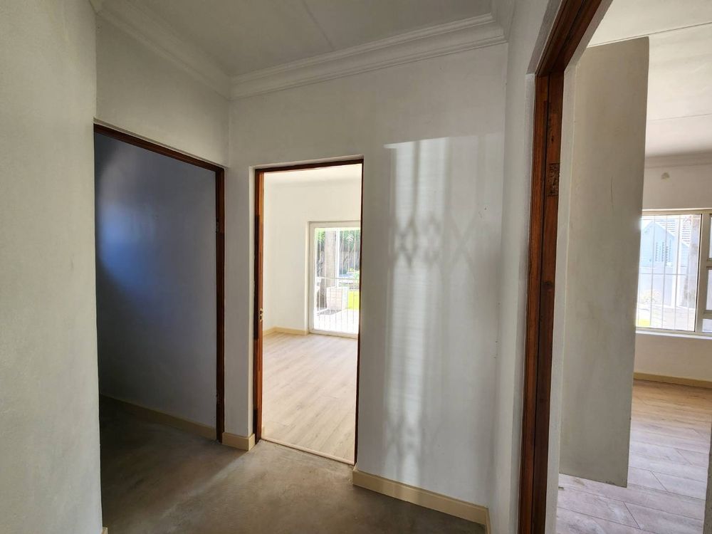 Hallway between bedrooms and bathroom