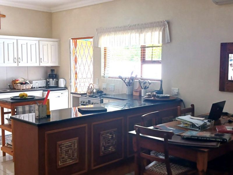 A tranquil setting complements this well established home - Photo 6
