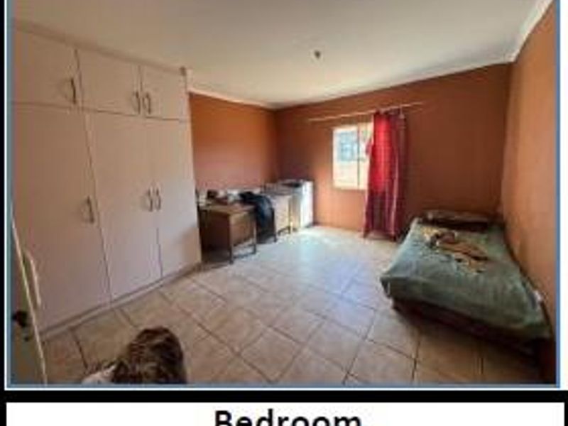 Charming Three-Bedroom Gem Awaits Your Touch - Photo 9