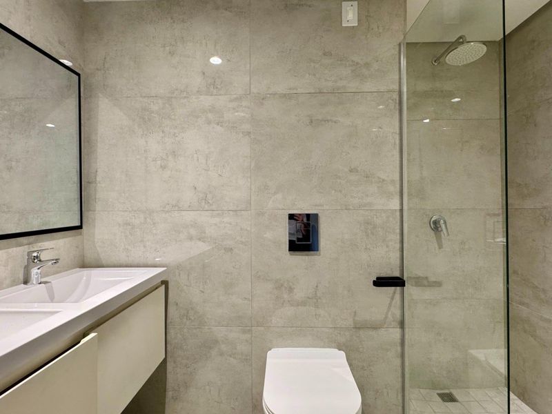 This is a premium, move-in-ready coastal apartment that combines luxury, security, and modern convenience in a sleek, never-before-lived-in space. - Photo 10