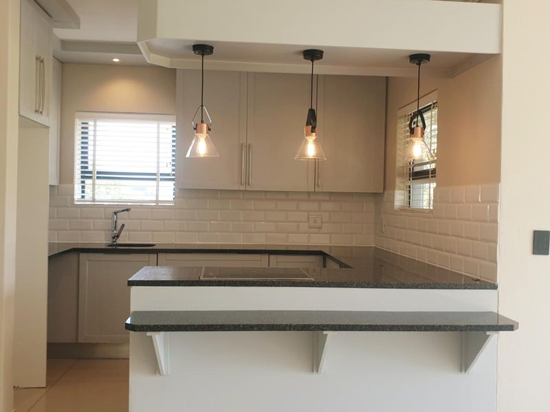 Swing Into Style: Sunlit 1st Floor Haven with Designer Kitchen in Golf Estate - Photo 4