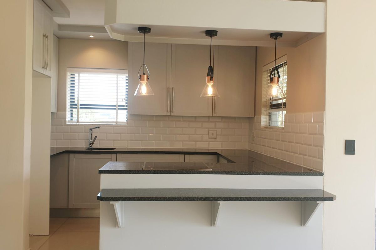 Swing Into Style: Sunlit 1st Floor Haven with Designer Kitchen in Golf Estate - Photo 4