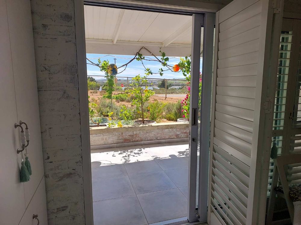 Main bedroom door opens onto verandah