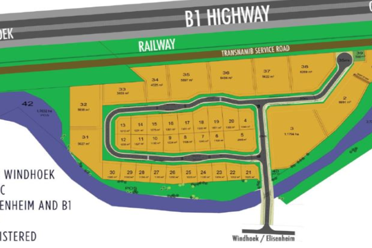 A detailed site layout plan showing multiple commercial land plots, road access, and proximity to the B1 highway and railway infrastructure.