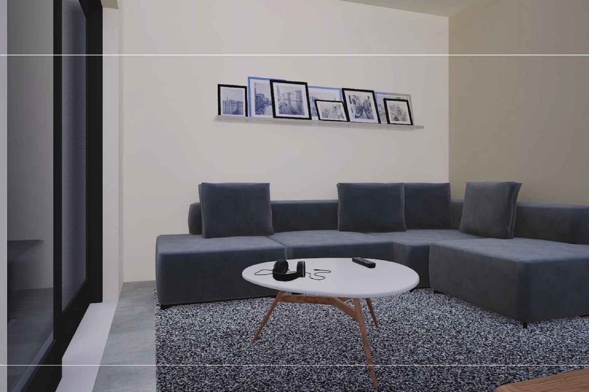 A modern living room featuring large sliding glass doors that provide access to outdoor space, finished with neutral walls and tiled flooring.