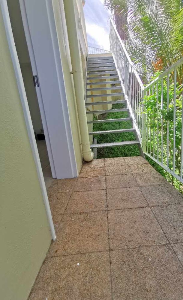 3RD FLOOR - STAIRCASE GOING DOWN TO A STOREROOM , POOL PUMP AREA, WATER TANKS AND FLATLET 
