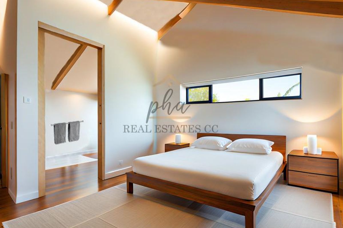 Spacious bedroom featuring vaulted ceilings with exposed timber beams, warm hardwood flooring, and modern recessed lighting, creating a bright and airy atmosphere.