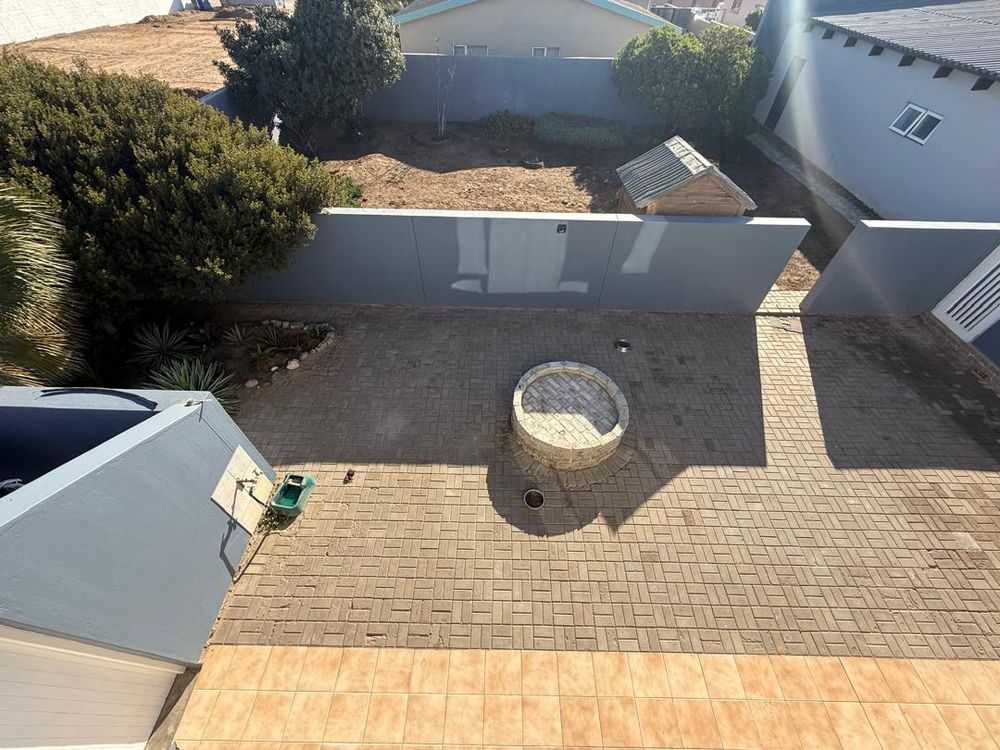 Balcony looking over the backyard. Open area for more rooms to be built. Boma for outdoor BBQ