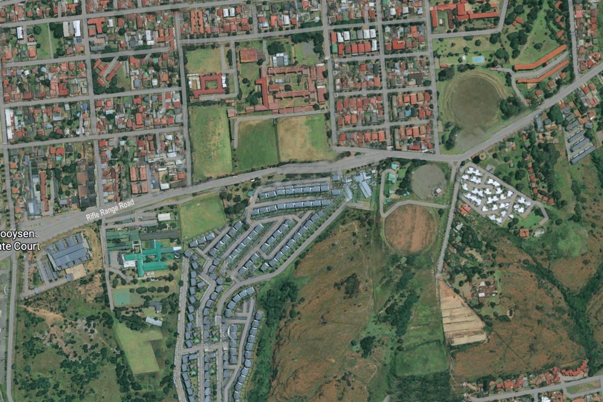 An aerial satellite view showing the surrounding neighborhood, road infrastructure, and local landmarks near the property.