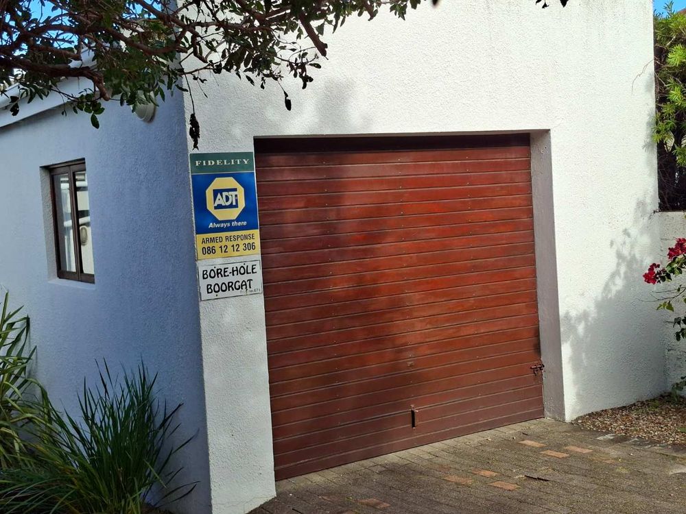 Single garage larger than normal positioned on West border line
