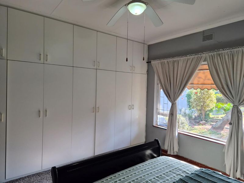 Spacious three-bedroom family home in Bluff featuring a swimming pool, lapa, and scenic garden views. Includes flatlet - Photo 10
