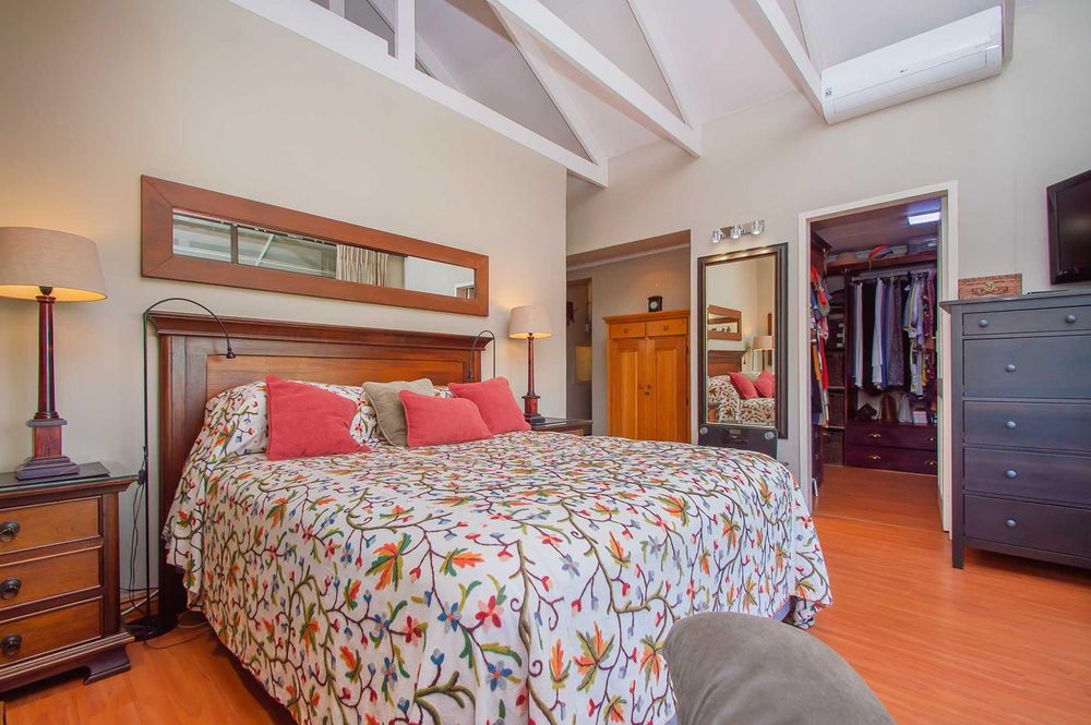 Main bedroom with dressing room in background