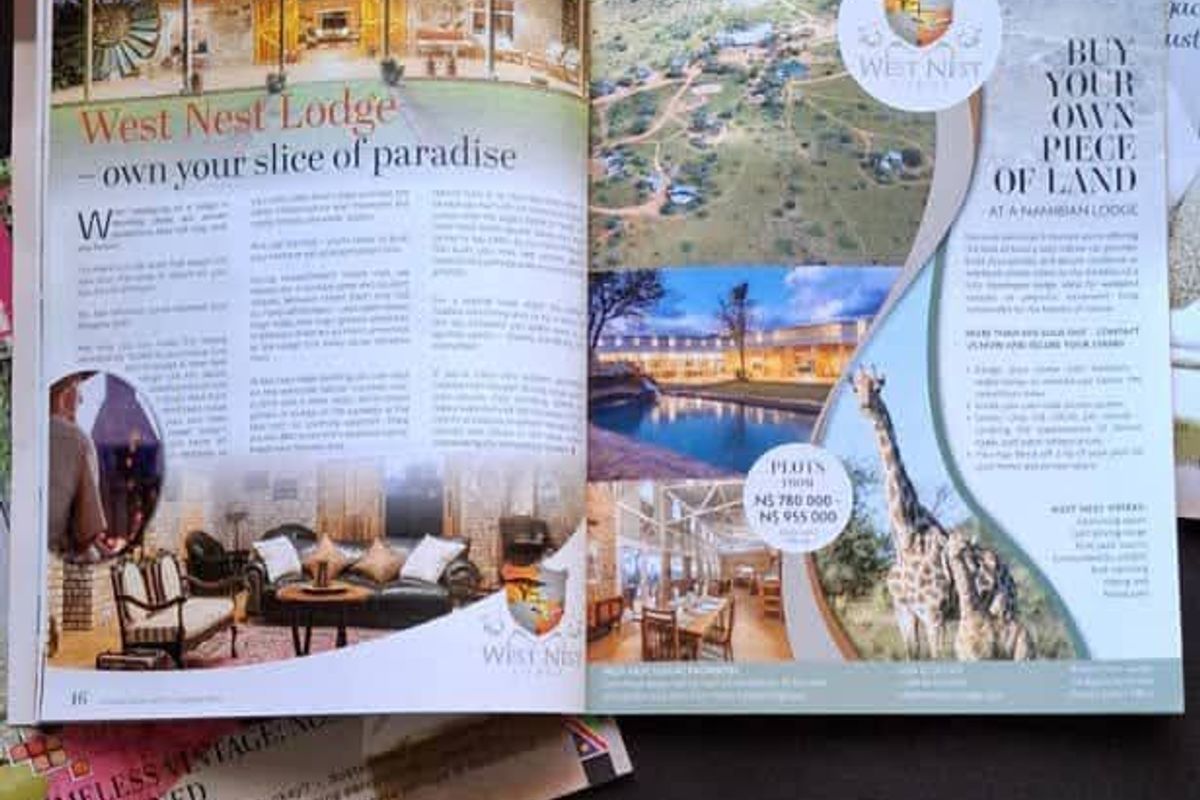 A magazine advertisement featuring promotional photography of West Nest Lodge and available residential land plots.