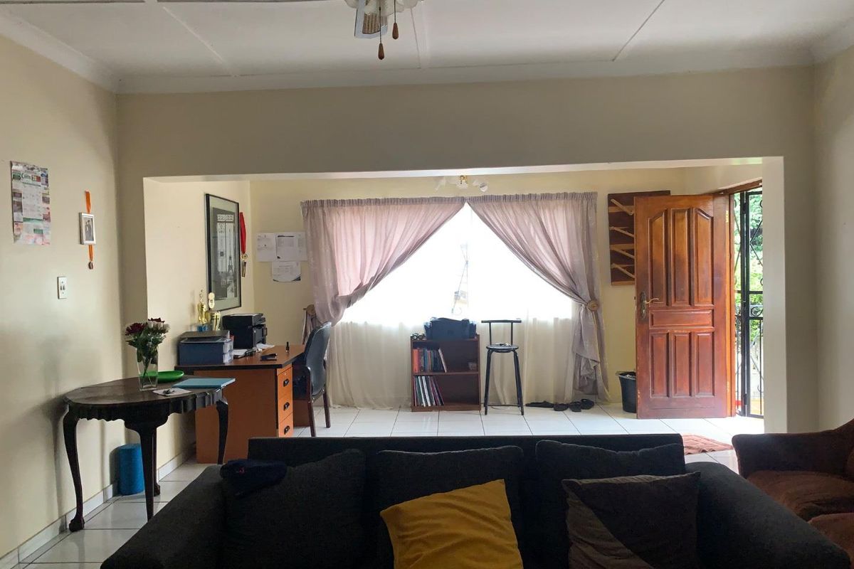 **Charming 3-Bedroom Home with Income Potential in a Tranquil Neighborhood** - Photo 4