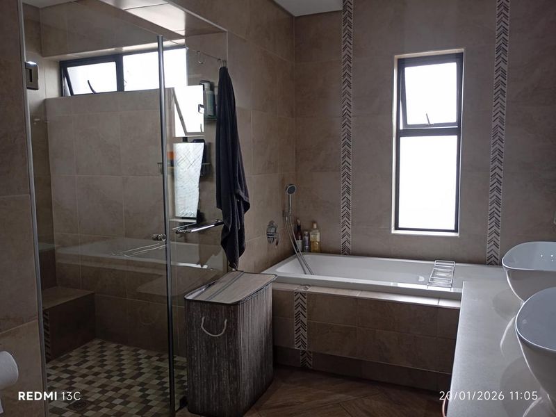 Elegant Family Living in Secure Glen Eagle Estate - Photo 9