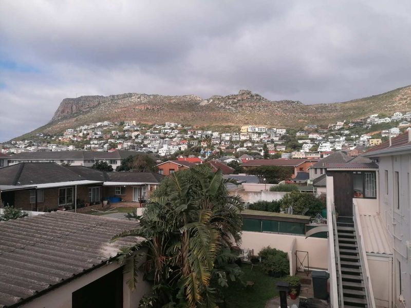 Elevated view overlooking the surrounding residential neighbourhood with a prominent mountain backdrop.