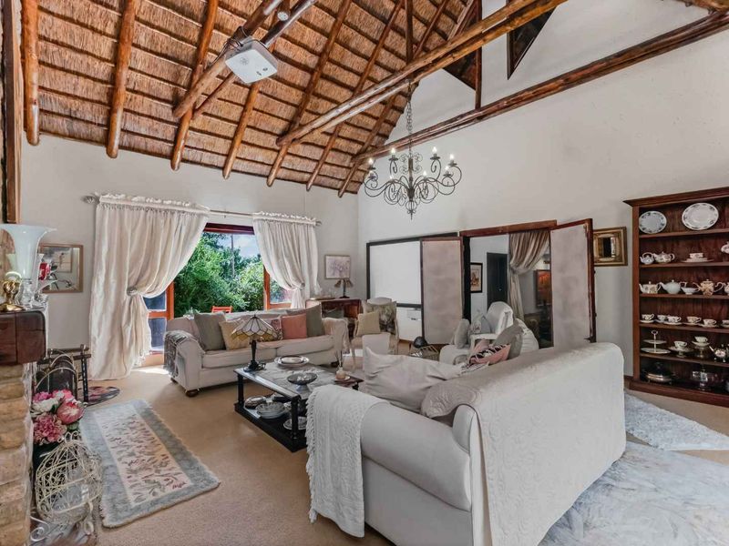 AN EXQUISITE, BUSH LODGE-THEMED, FAMILY SANCTUARY OFFERING TIMELESS ELEGANCE AND UNMATCHED TRANQUILITY IN A SERENE INDIGENOUS GARDEN SETTING - Photo 9