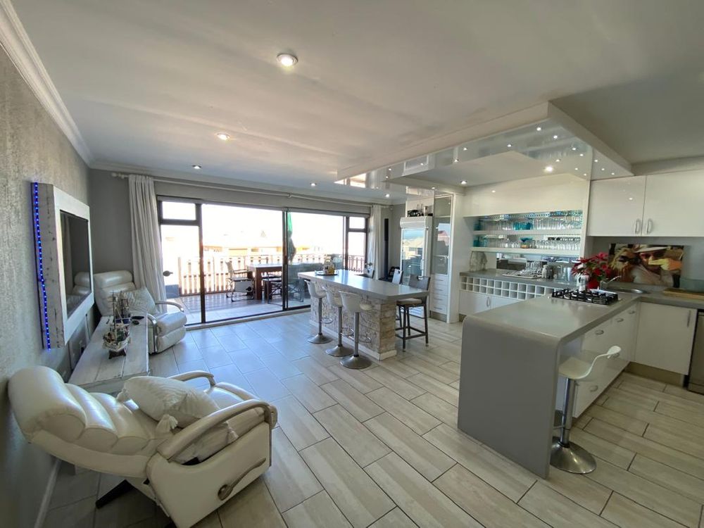 First floor open-plan lounge, kitchen and lounge with balcony