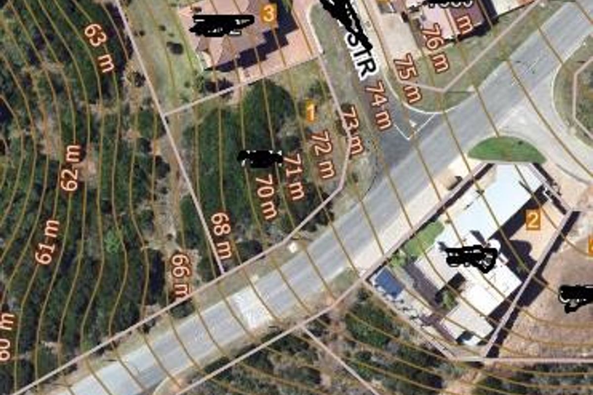 Aerial view of a residential vacant land plot showing topographical contour lines and surrounding street infrastructure.