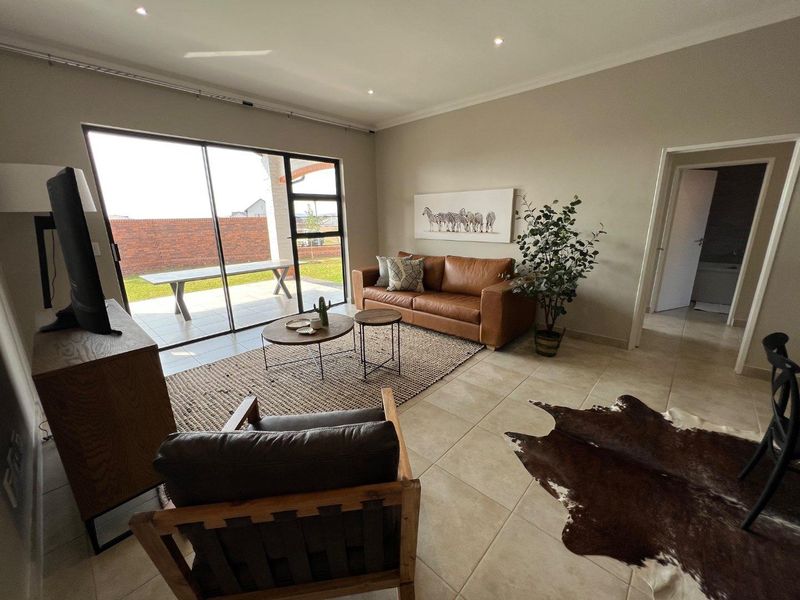 Unique iQ Marula 3-Bedroom Single-Level Townhouse with stacking doors by the patio and Double Garage - Photo 8