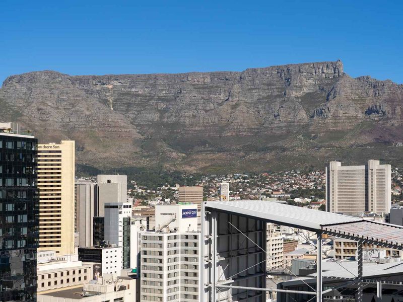 A clear, elevated cityscape view featuring the iconic Table Mountain in the background.
