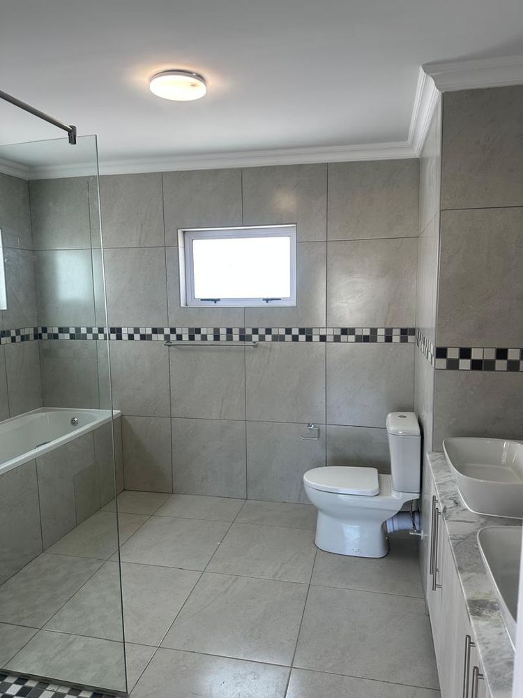 Onsuite bathroom with bath and shower