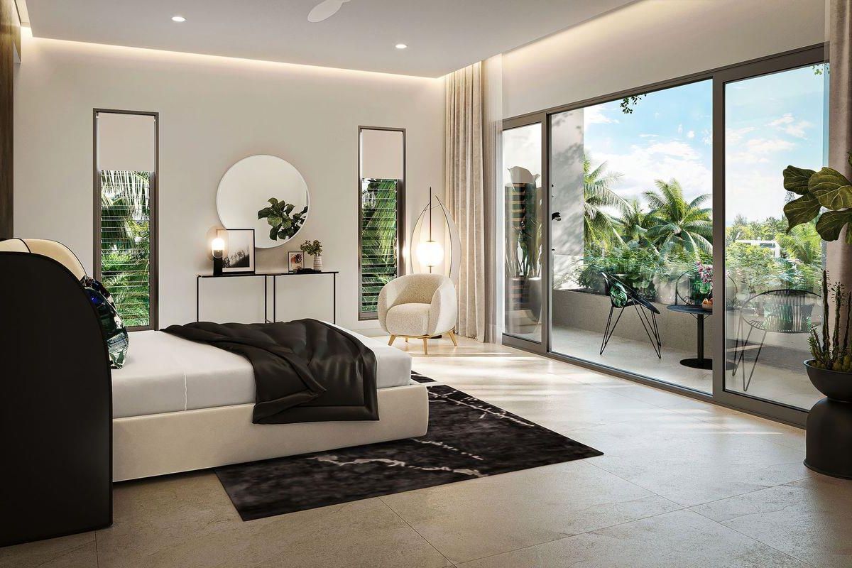 Spacious bedroom featuring large sliding glass doors that open onto a private balcony, recessed ceiling lighting, and modern tiled flooring.