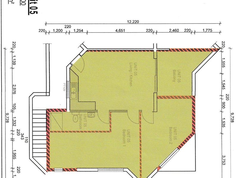 Architectural floor plan for Unit 05, showing a two-bedroom apartment layout with an open-plan living area, kitchen, bathroom, and balcony.