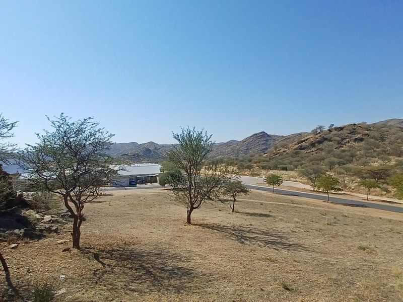 Panoramic view of the surrounding landscape and hills, captured from an elevated balcony position.