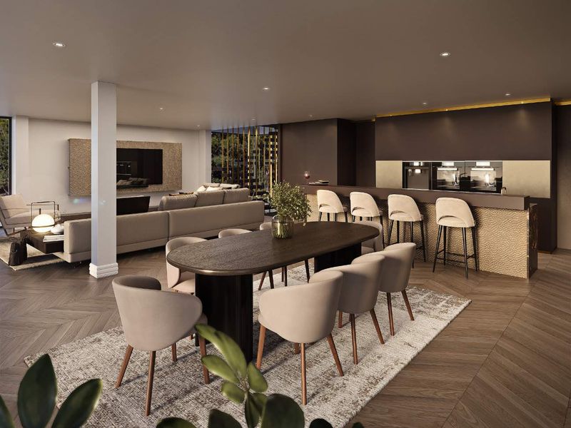 Modern open-plan living area featuring herringbone timber flooring, a sleek kitchen with integrated appliances, and a spacious dining zone.