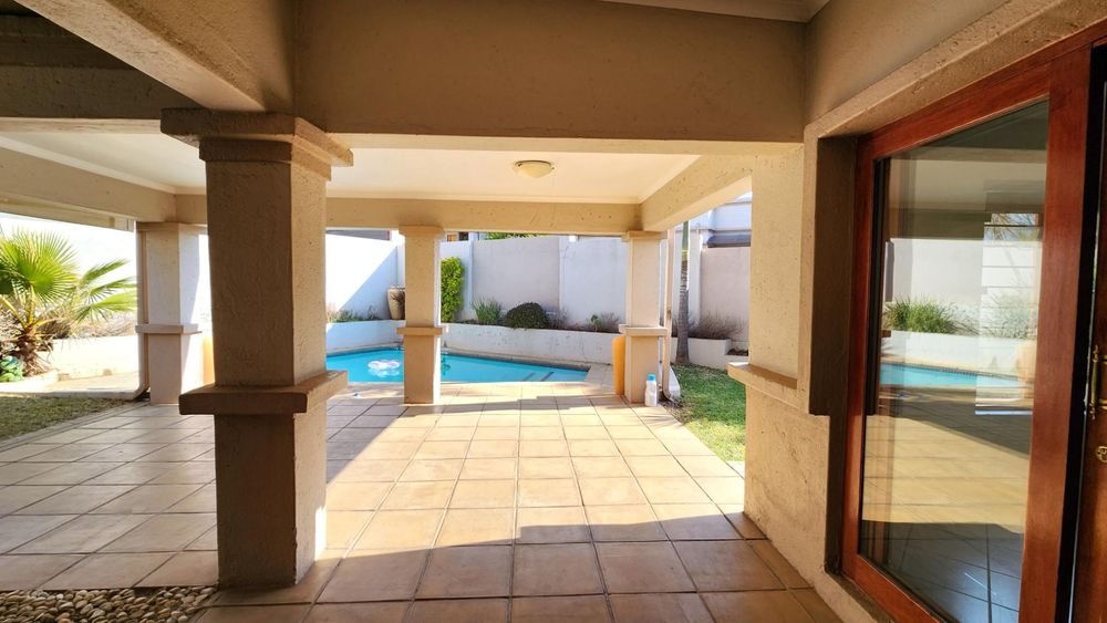 View from dining room sliding door to the pool.