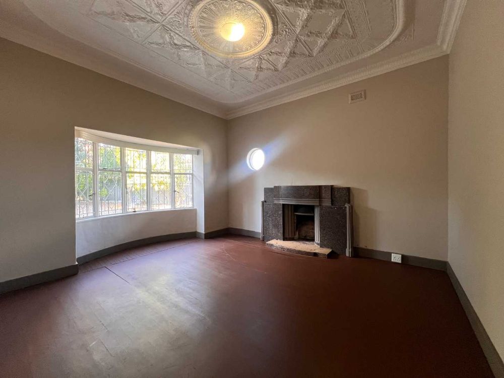 Lounge dining with marble fireplace and feature windows