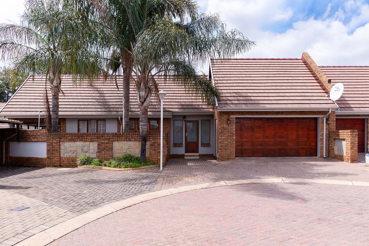 Lovely 3-bedroom facebrick home with a pool situated in a secure estate in Glen Marais - Photo 2