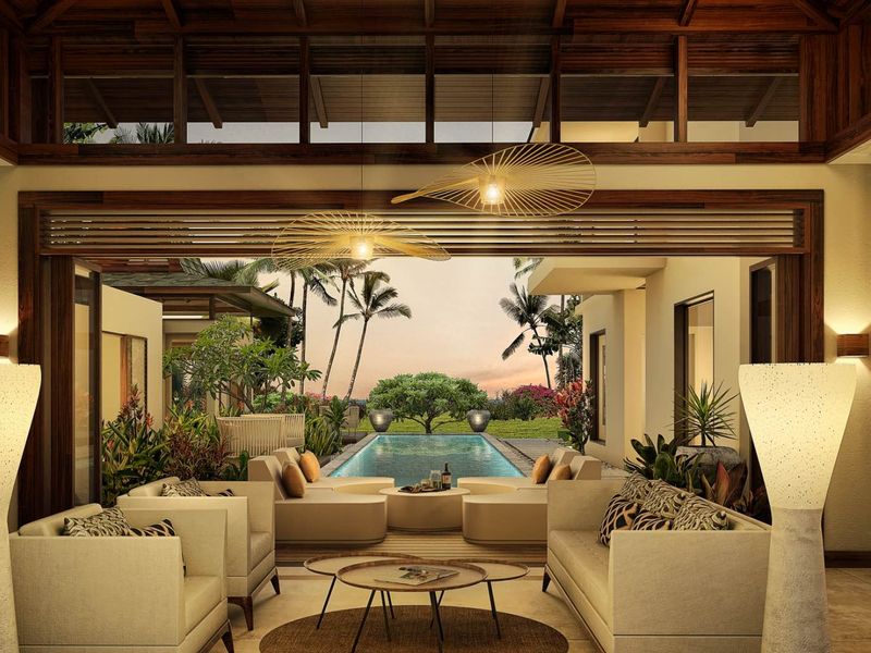 Luxurious open-plan living area featuring high timber ceilings, stone flooring, and seamless indoor-outdoor flow to a private swimming pool and landscaped garden.