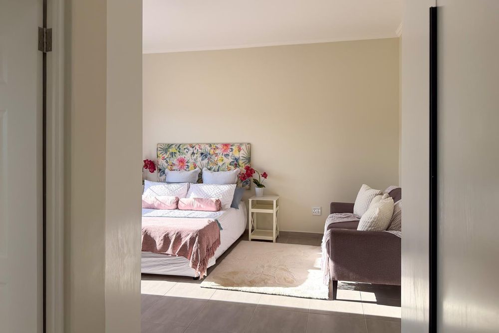 Large main bedroom with built-in cupboards, a dressing room and ensuite bathroom.