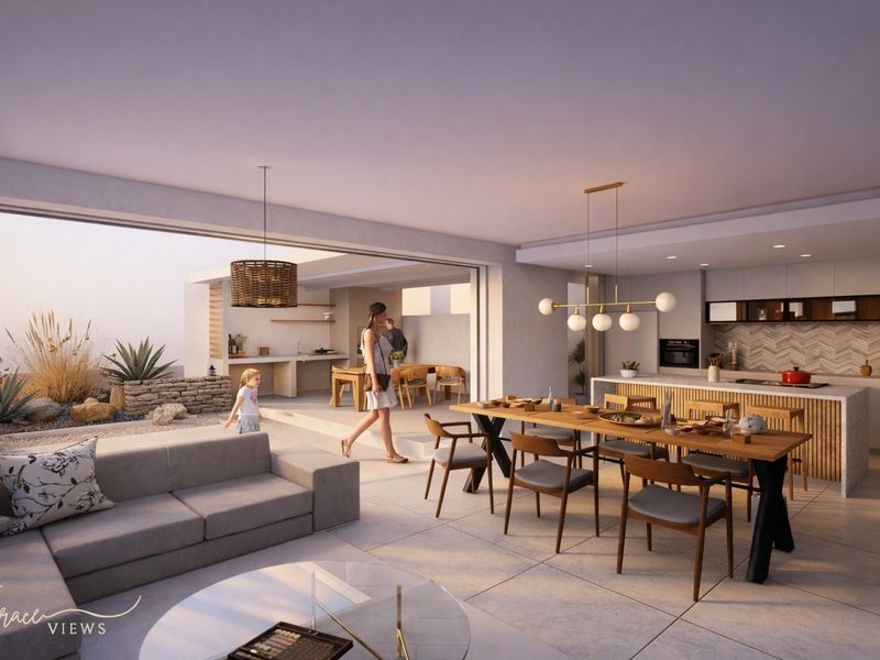 Modern open-plan living and kitchen area featuring high-end finishes, seamless indoor-outdoor flow to a patio, and contemporary architectural design.