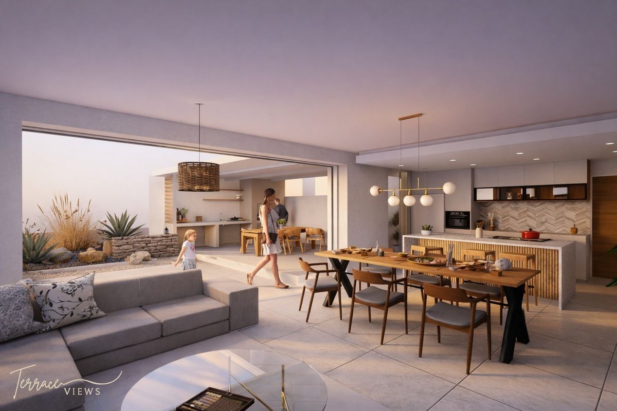 Modern open-plan living and kitchen area featuring high-end finishes, seamless indoor-outdoor flow to a patio, and contemporary architectural design.