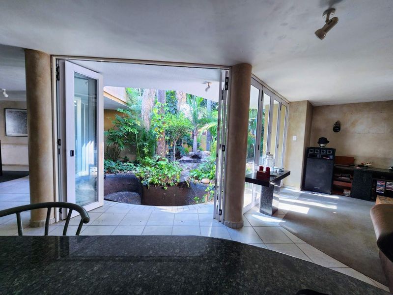 Mid-Century Modern Oasis with Lush Tropical Garden and Private Office - Photo 9