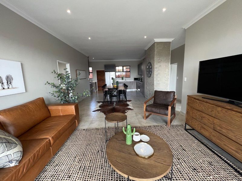 Unique iQ Marula 3-Bedroom Single-Level Townhouse with stacking doors by the patio and Double Garage - Photo 4