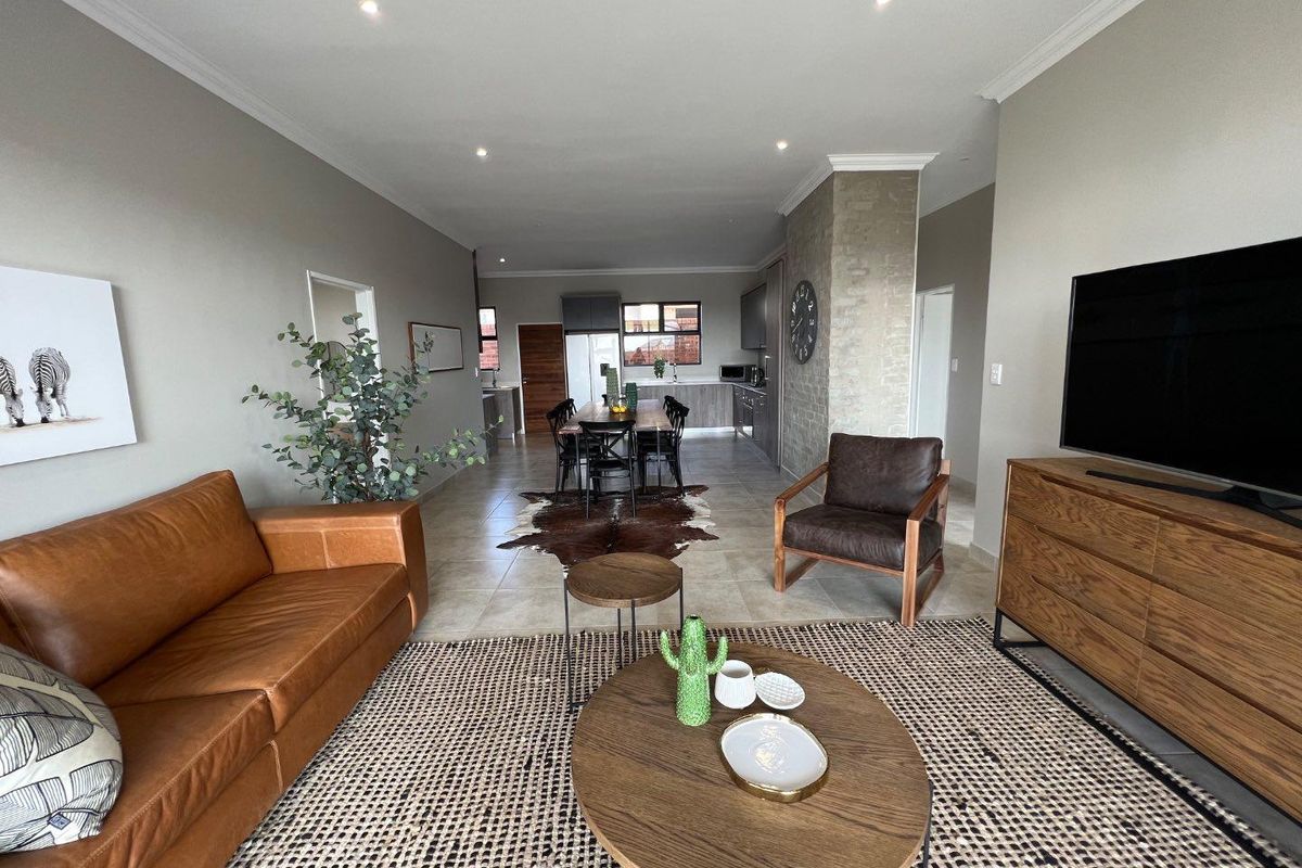 Unique iQ Marula 3-Bedroom Single-Level Townhouse with stacking doors by the patio and Double Garage - Photo 4