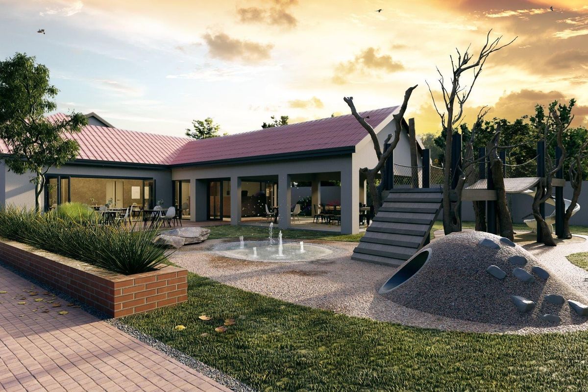 A professionally rendered exterior view of a modern communal garden area featuring a playground, water feature, and covered patio space.